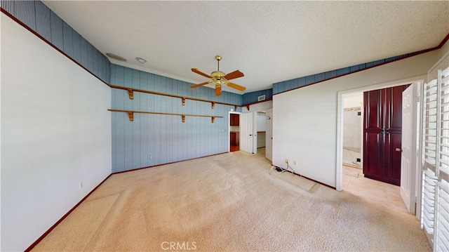 279 White Oak Rd, Lake Elsinore, CA 92530 - carpeted empty room with a ceiling fan, a textured ceiling, and baseboards