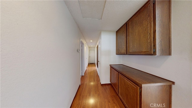 279 White Oak Rd, Lake Elsinore, CA 92530 - hallway with light wood-type flooring, a textured ceiling, and baseboards