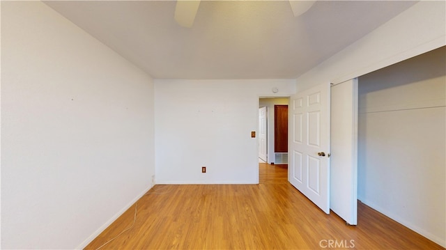 279 White Oak Rd, Lake Elsinore, CA 92530 - unfurnished bedroom featuring light wood-type flooring, baseboards, a closet, and ceiling fan