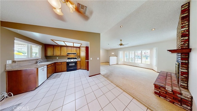 279 White Oak Rd, Lake Elsinore, CA 92530 - kitchen with light carpet, range with gas cooktop, white dishwasher, under cabinet range hood, and healthy amount of natural light