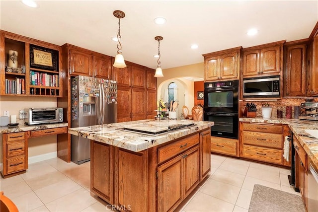 6723 Sycamore Ln, Palmdale, CA 93551 - kitchen featuring stainless steel appliances, arched walkways, light tile patterned flooring, light stone countertops, and recessed lighting