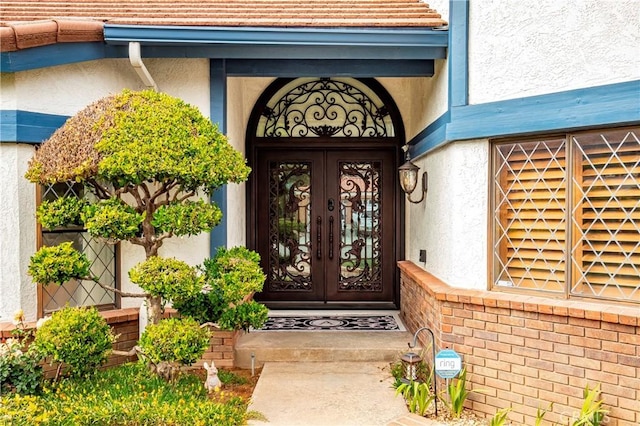 6723 Sycamore Ln, Palmdale, CA 93551 - entrance to property with french doors and stucco siding
