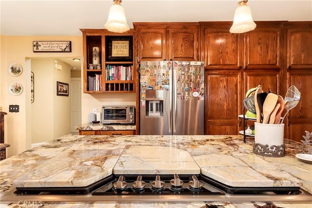 6723 Sycamore Ln, Palmdale, CA 93551 - kitchen with stainless steel fridge with ice dispenser, light countertops, and pendant lighting