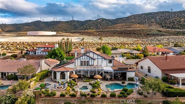 6723 Sycamore Ln, Palmdale, CA 93551 - view from above of property with a mountainous background and a pool