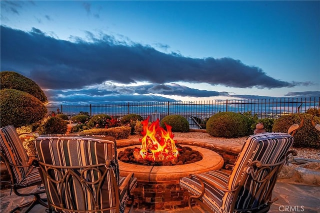 6723 Sycamore Ln, Palmdale, CA 93551 - view of patio with a fire pit and fence