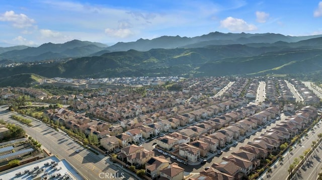 aerial view of property and surrounding area with mountains
