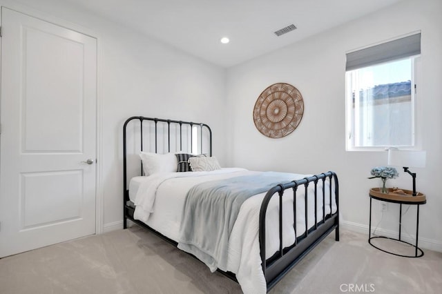 carpeted bedroom with baseboards and recessed lighting