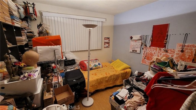 bedroom with wood finished floors