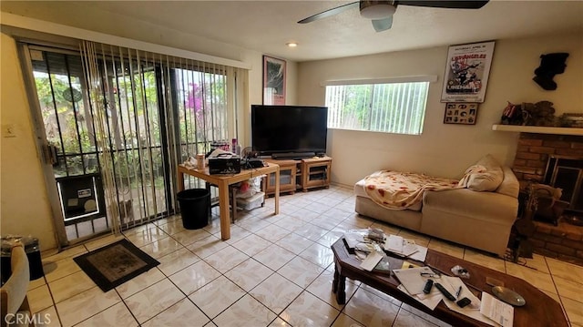 tiled living area featuring ceiling fan