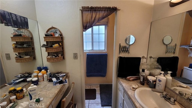 bathroom featuring tile patterned floors and vanity