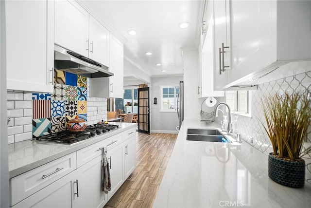 1742 Dixon St, Redondo Beach, CA 90278 - kitchen with a sink, stainless steel gas stovetop, under cabinet range hood, recessed lighting, and tasteful backsplash