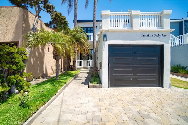 1742 Dixon St, Redondo Beach, CA 90278 - view of front of house featuring an attached garage, stucco siding, and driveway