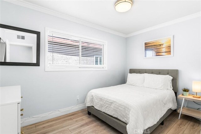 1742 Dixon St, Redondo Beach, CA 90278 - bedroom featuring wood finished floors, ornamental molding, and baseboards