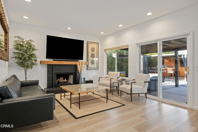 800 Coronado Pl, Oxnard, CA 93030 - living room with a brick fireplace, recessed lighting, and light wood-style flooring