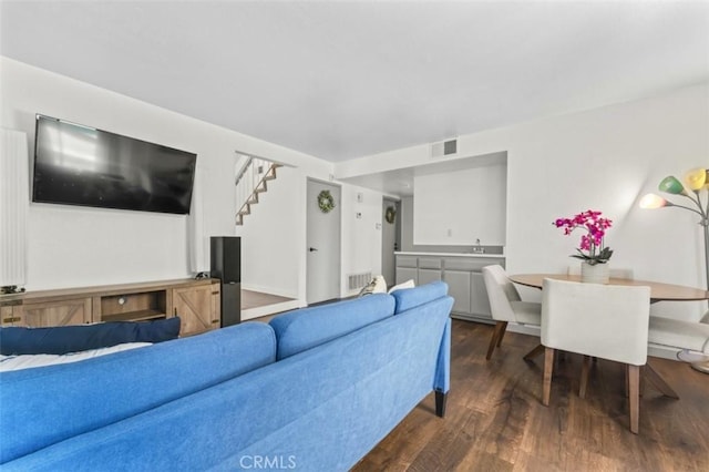 22833 Finch St, Grand Terrace, CA 92313 - living room featuring dark wood-style floors and stairs