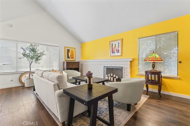 22833 Finch St, Grand Terrace, CA 92313 - living room featuring healthy amount of natural light, a brick fireplace, dark wood-type flooring, and high vaulted ceiling