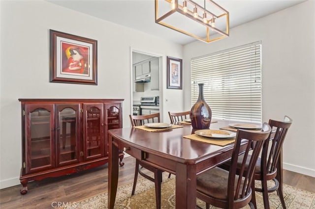 22833 Finch St, Grand Terrace, CA 92313 - dining room featuring dark wood-type flooring and baseboards