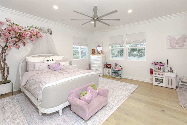 bedroom featuring crown molding, light wood finished floors, recessed lighting, ceiling fan, and baseboards