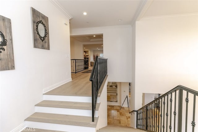 staircase with crown molding, recessed lighting, and baseboards