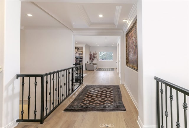 corridor featuring wood finished floors, an upstairs landing, crown molding, baseboards, and recessed lighting