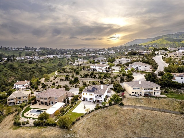 aerial perspective of suburban area featuring a mountainous background