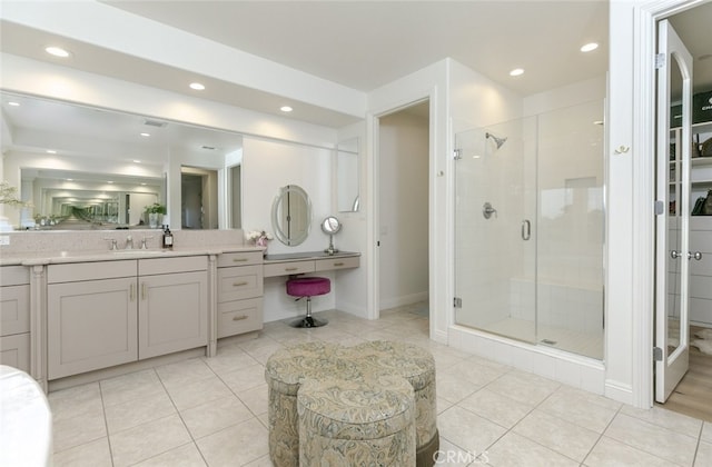 full bathroom featuring a stall shower, recessed lighting, tile patterned flooring, vanity, and baseboards