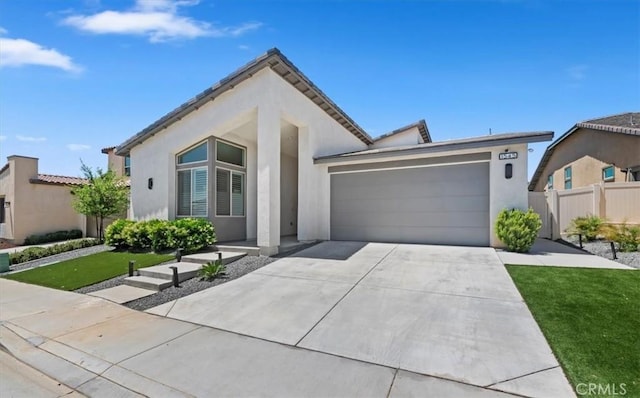 1545 Winding Sun Dr, Beaumont, CA 92223 - view of front of property featuring a garage, stucco siding, and driveway