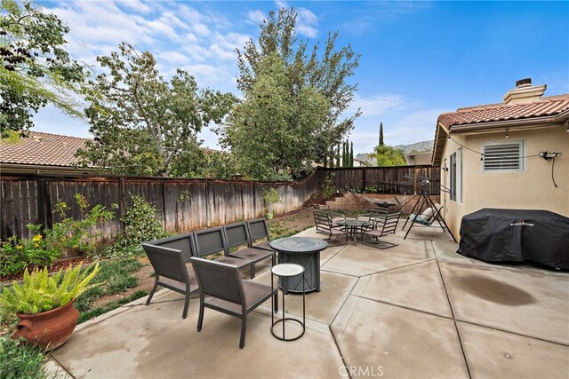 view of patio / terrace featuring outdoor dining area and a fenced backyard