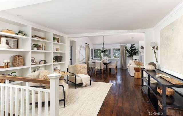 living area with hardwood / wood-style flooring and crown molding