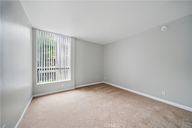 7826 Topanga Canyon Blvd Unit 218, Canoga Park, CA 91304 - unfurnished room with carpet, baseboards, and a smoke detector