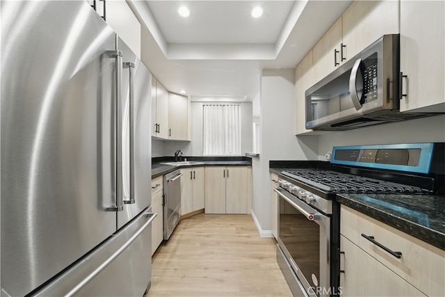 7826 Topanga Canyon Blvd Unit 218, Canoga Park, CA 91304 - kitchen with appliances with stainless steel finishes, light wood finished floors, a sink, light brown cabinetry, and recessed lighting