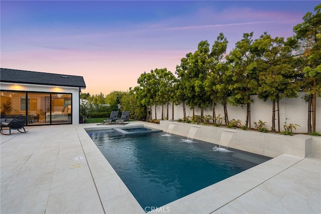 1530 Anita Ln, Newport Beach, CA 92660 - pool at dusk featuring a patio area, a fenced backyard, and a pool with connected hot tub