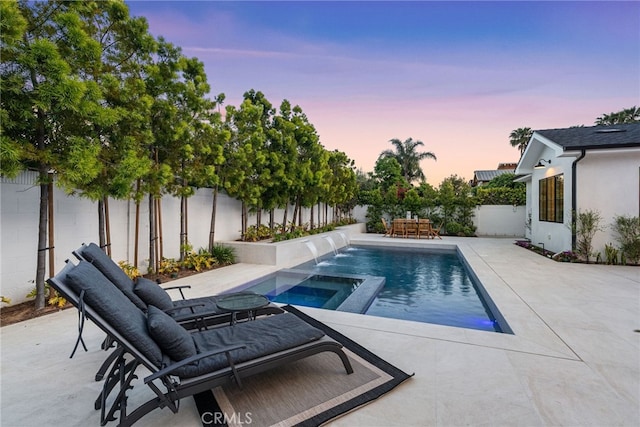 1530 Anita Ln, Newport Beach, CA 92660 - pool at dusk featuring a patio, a fenced backyard, and an in-ground hot tub