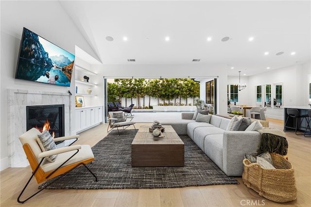 1530 Anita Ln, Newport Beach, CA 92660 - living room with a premium fireplace, light wood-type flooring, lofted ceiling, recessed lighting, and plenty of natural light