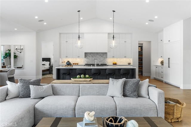 1530 Anita Ln, Newport Beach, CA 92660 - living room with light wood-style flooring, recessed lighting, and high vaulted ceiling