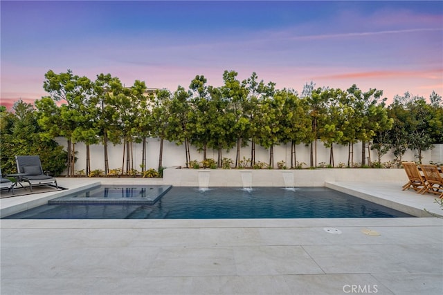 1530 Anita Ln, Newport Beach, CA 92660 - pool at dusk featuring a patio and a pool with connected hot tub
