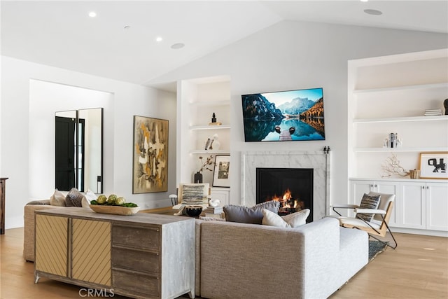 1530 Anita Ln, Newport Beach, CA 92660 - living room with vaulted ceiling, a high end fireplace, built in features, light wood-type flooring, and recessed lighting