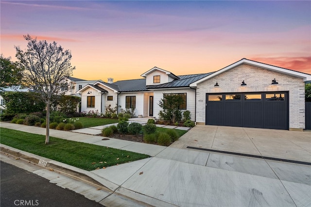 1530 Anita Ln, Newport Beach, CA 92660 - modern inspired farmhouse featuring an attached garage, a standing seam roof, a lawn, concrete driveway, and a metal roof