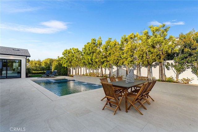 view of pool with a patio area, a fenced backyard, and outdoor dining area