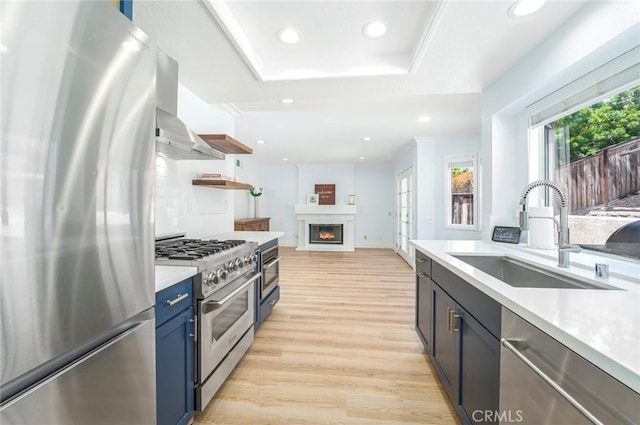 16 Allyssum, Rancho Santa Margarita, CA 92688 - kitchen featuring stainless steel appliances, a sink, open shelves, light wood finished floors, and recessed lighting