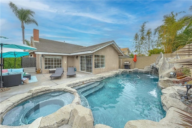 view of swimming pool with an outdoor hangout area, a fenced backyard, a patio, a grill, and a pool with connected hot tub