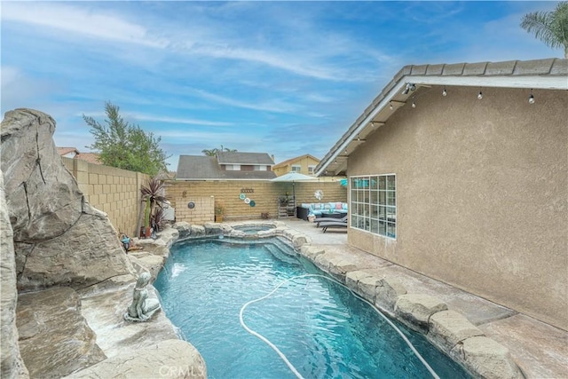 view of swimming pool featuring a patio, a fenced backyard, an outdoor hangout area, and a pool with connected hot tub