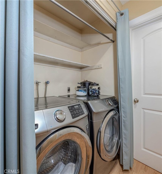 washroom with washer and clothes dryer