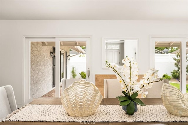 dining area featuring healthy amount of natural light and wood finished floors
