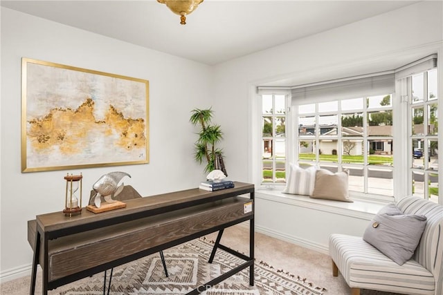 carpeted office featuring baseboards
