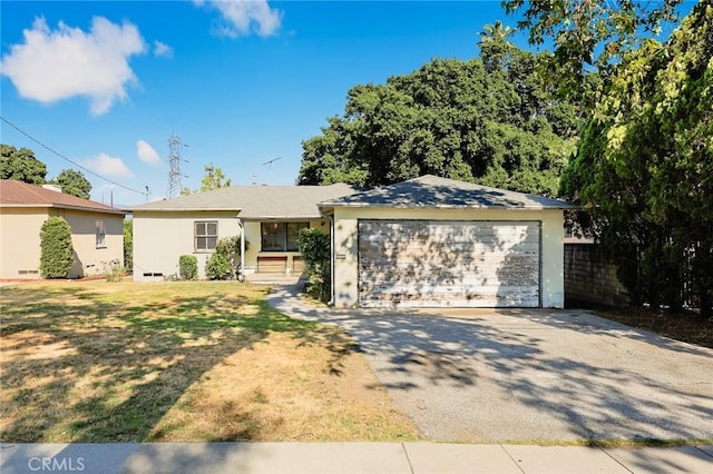 single story home featuring driveway, an attached garage, and stucco siding