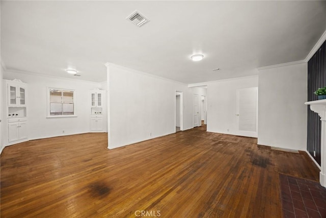 unfurnished living room featuring hardwood / wood-style floors, crown molding, and a fireplace