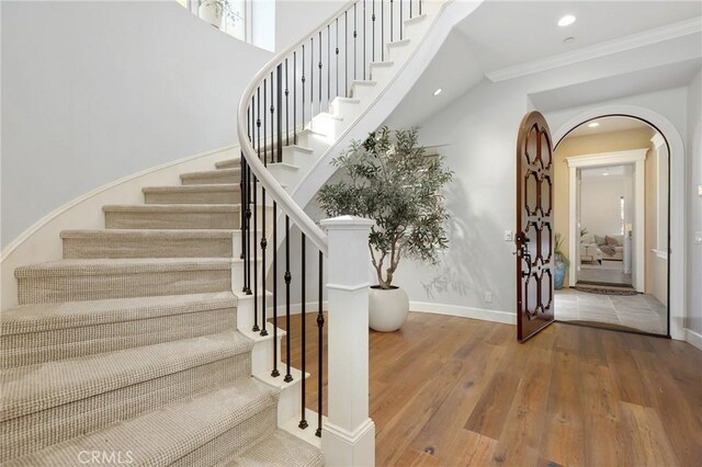 25 Tenderfoot, Irvine, CA 92602 - stairway featuring wood finished floors, recessed lighting, baseboards, ornamental molding, and arched walkways
