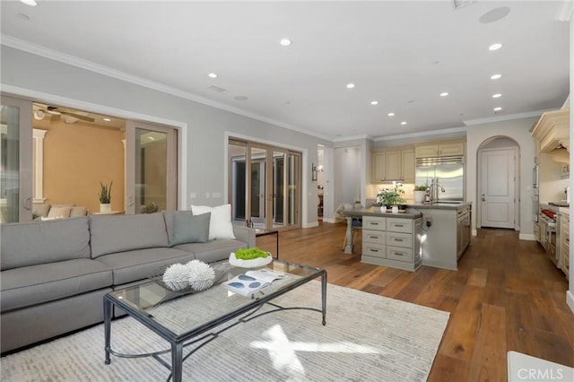 25 Tenderfoot, Irvine, CA 92602 - living room featuring recessed lighting, wood finished floors, crown molding, and baseboards