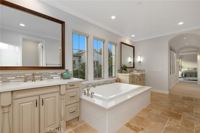 25 Tenderfoot, Irvine, CA 92602 - bathroom featuring healthy amount of natural light, stone tile flooring, crown molding, backsplash, and two vanities